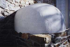 Looking at the outside of a restored beehive oven