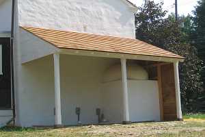 A awning over a beehive bake oven