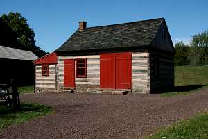 new doors, windows, roof, and walls on an old log cabin