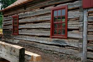 old log cabin with large gaps between logs