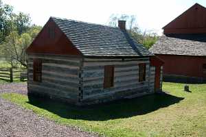restored log cabin exterior with filled in log gaps