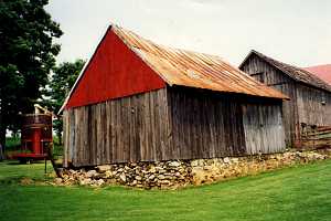 a before picture of an old shed on a crumbling foundation