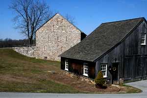 a restored barn and carriage shed