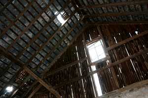 interior shot of damaged barn roof