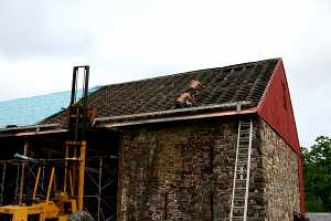 roofers removing existing barn roof