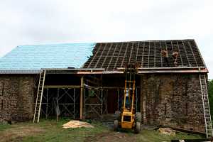 roofers removing existing barn roof
