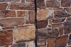 a slot in the stone wall of a barn