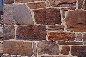 a restored stone wall of a barn