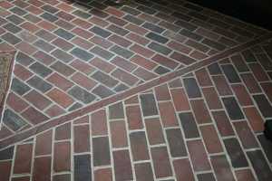 a closeup photo of a brick floor