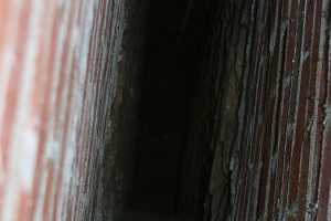 The inside of a chimney flue being repaired