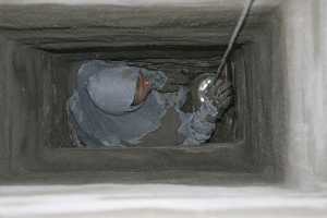 A chimney flue in the process of being repaired