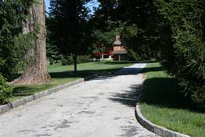 A modern driveway lined with cobblestones