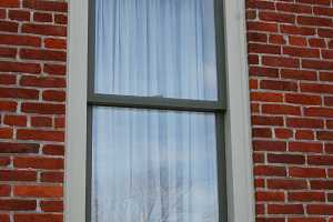 a window on a brick home