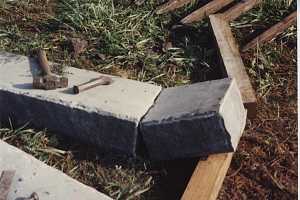 A square stone cut out of a larger piece of stone