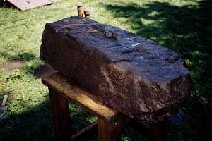 A large stone being prepped for cutting to be used in a grate restoration