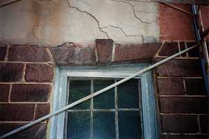 An old stone window frame in need of repair