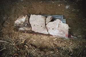 A stone grate cracked and in need of replacement