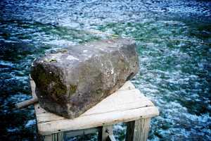 A stone being shaped for a custom grate replacement