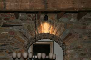 Stone arch doorway with accent lighting