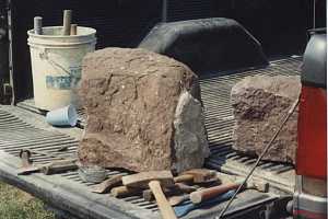 A large stone being prepped for cutting