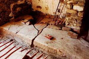 old fireplace hearth stone being removed