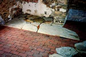 old fireplace hearth stone being removed