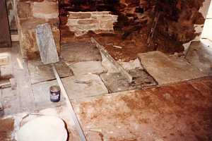 old fireplace hearth stone being removed and replaced