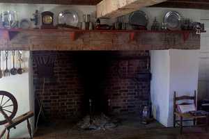 a brick fireplace in an old home