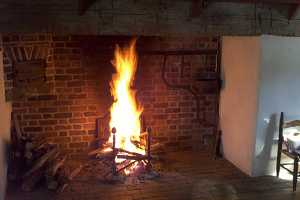 a fire in a brick fireplace