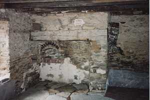 an old stone fireplace that is in bad shape - before