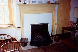 a fully restored fireplace, mantel and cabinet area - after