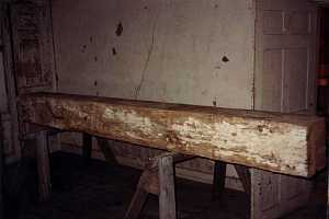 a wooden beam on two saw horses