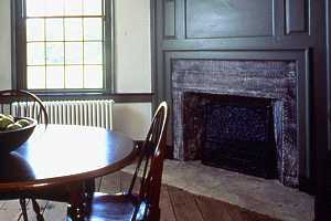 a restored kitchen and fireplace in a historic home - after