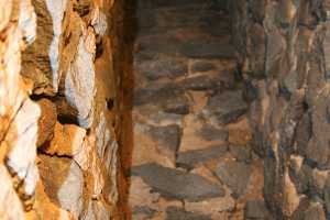 looking up a stone fireplace chimney