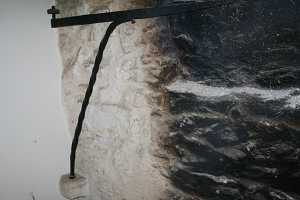 back wall of a fireplace with black soot built up