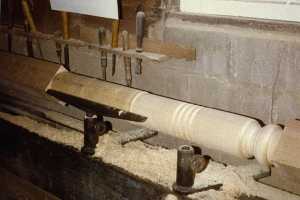a wooden post being made