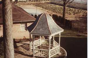 a brand new gazebo next to a home