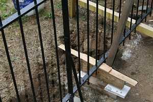 a black iron fence installation