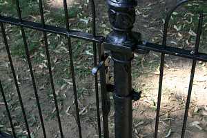 a black iron fence gate