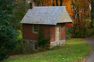 A fully restored red brick spring house