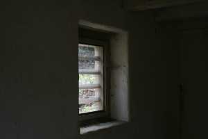 A window looking out of a spring house