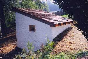 Side view of a stone spring house