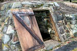 An underground spring house with it's door open