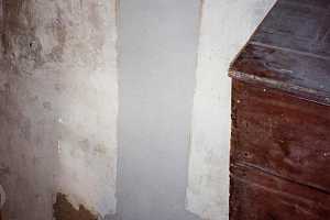 a concrete wall with new concrete clearly drying