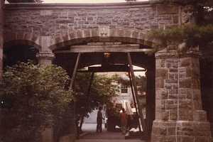 Stone archway being prepped with wooden scaffolding for repair