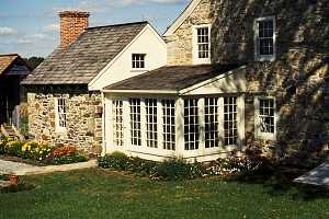 Exterior of rebuilt and restored enclosed stone patio