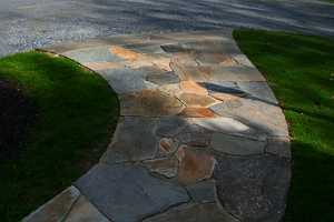 a curved stone sidewalk