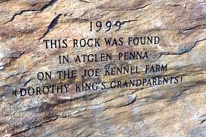 a stone that is engraved with the words: 1999 this rock was found in atglen penna on the joe kennel farm (dorothy king's grandparents)