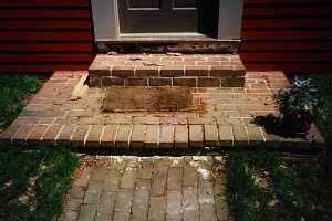 a brick porch and steps - before