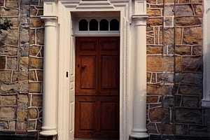 an entryway to a stone home